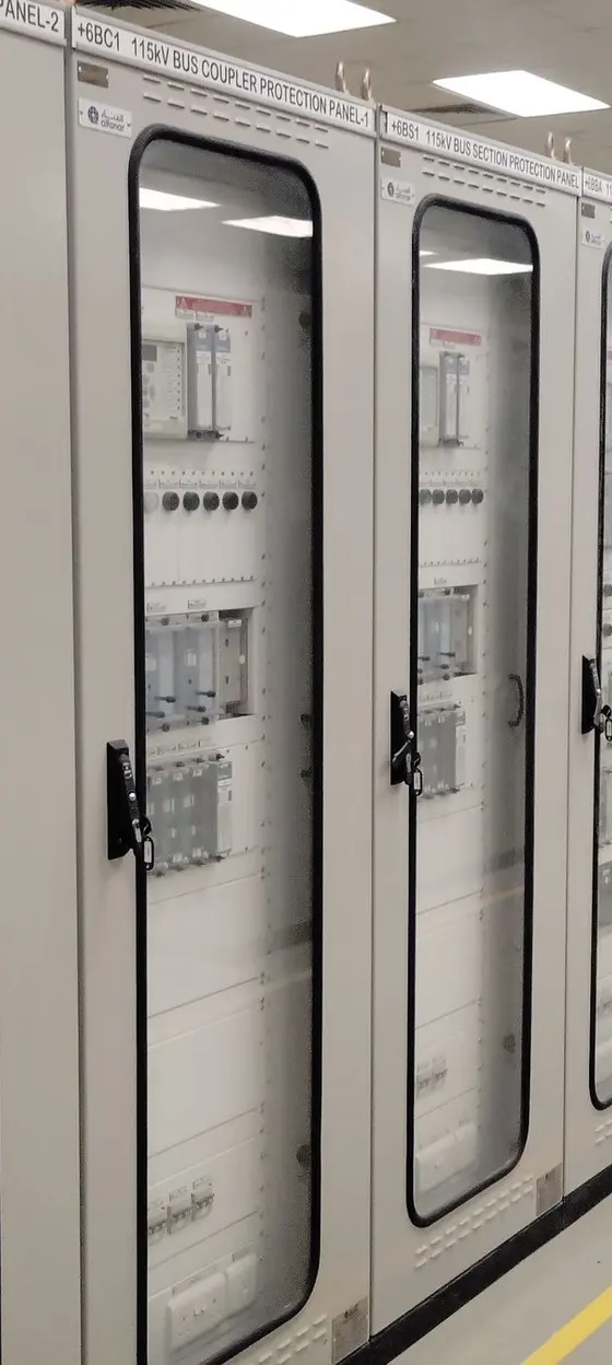 Electrical control room with rows of switchgear panels