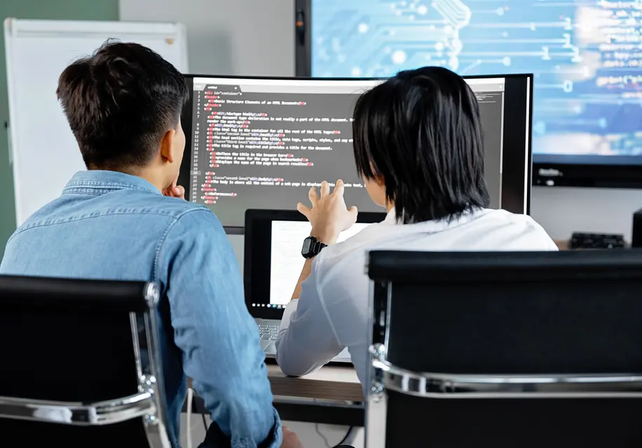 Two Rubicon developers reviewing code together